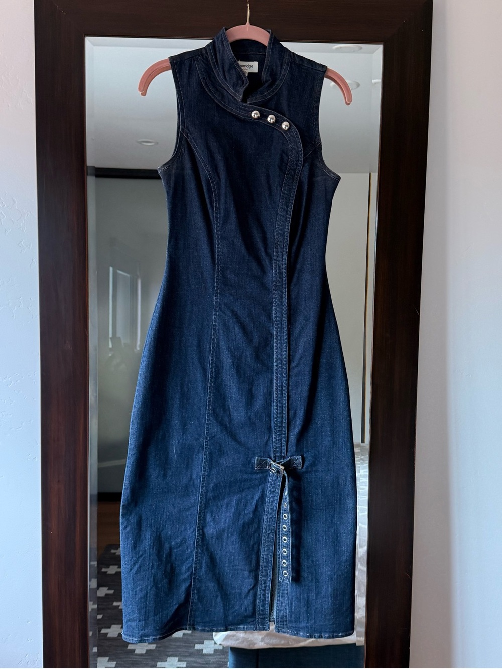 Sleeveless Dark Indigo Denim Dress with Asymmetric Snap Placket.